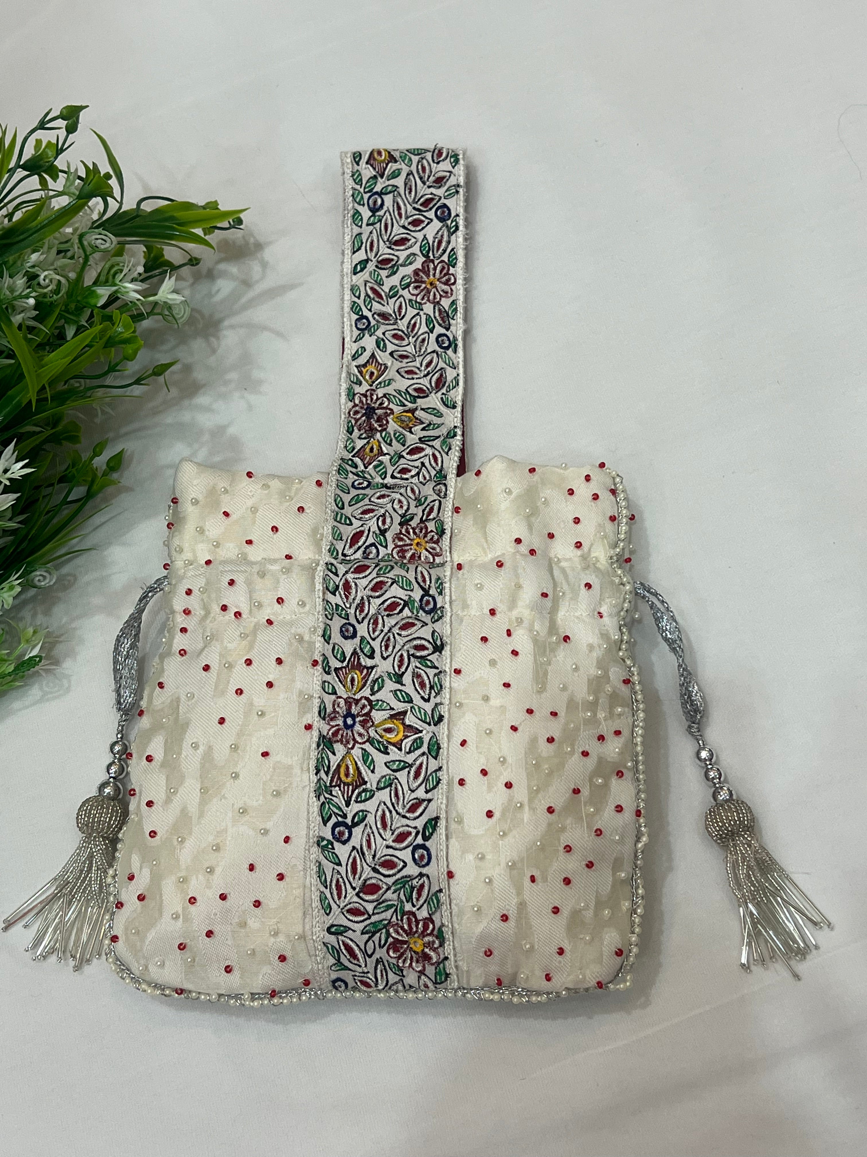 Hand-Painted White Potli with Pearl and Red Bead Accents
